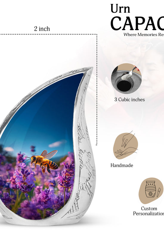 Celestial Blue Bee Cremation Urn angled view of lid and engraved motif - flowing teardrop bee silhouette on curved aluminum - mini keepsake memorial for portion of cremation ashes