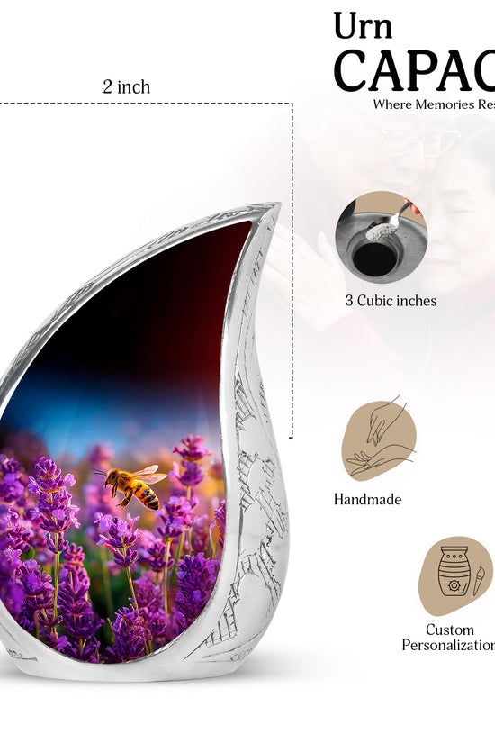 Vivid Blue Bee Cremation Urn angled view of lid and engraved motif - smooth teardrop contour featuring bee art - mini keepsake memorial for portion of cremation ashes