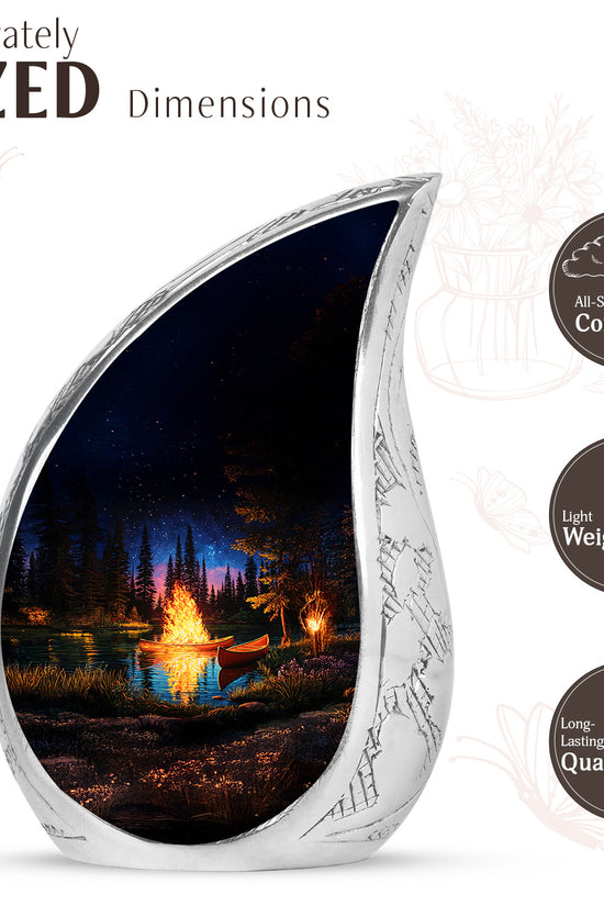Midnight Black Campfire Cremation Urn angled view of lid and engraved motif - smooth teardrop contour featuring campfire art - mini keepsake memorial for portion of cremation ashes