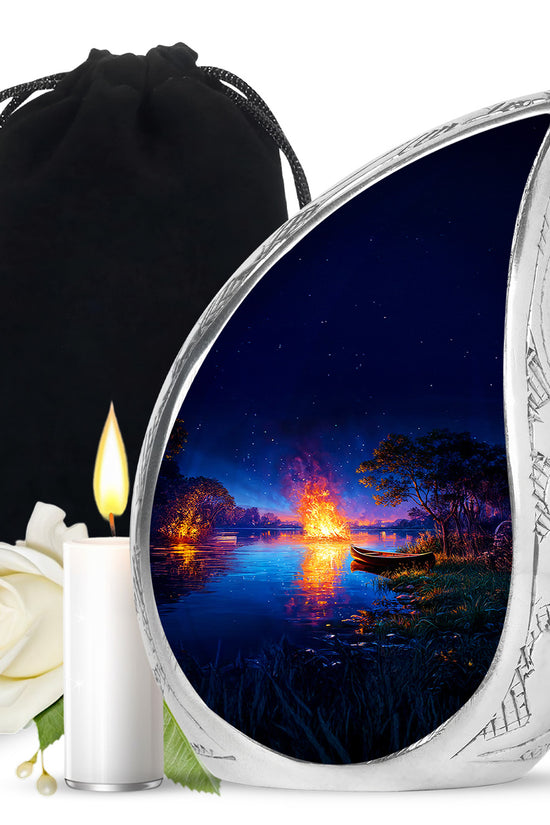 Pastel Blue Campfire Cremation Urn front view showing detailed design - flowing teardrop campfire silhouette on curved aluminum - full-size 10 inch 200 cubic inch adult cremation urn