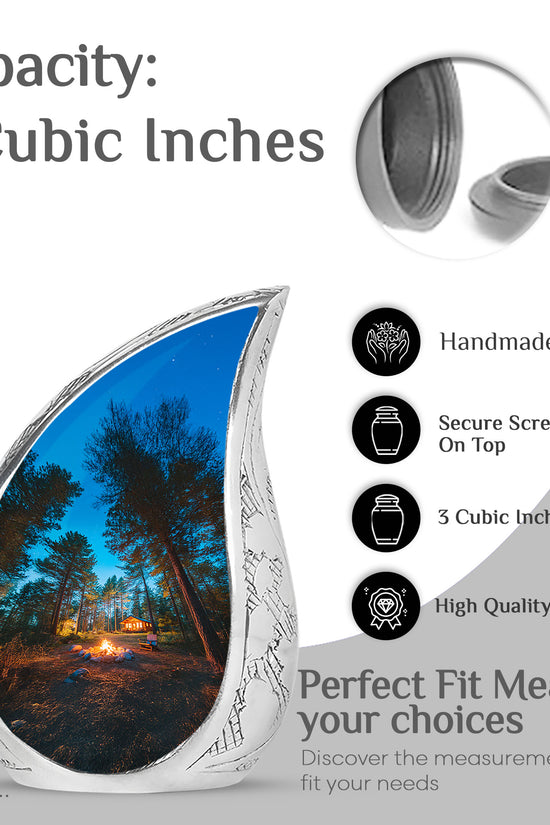 Dusty Blue Campfire Cremation Urn angled view of lid and engraved motif - flowing teardrop campfire silhouette on curved aluminum - mini keepsake memorial for portion of cremation ashes