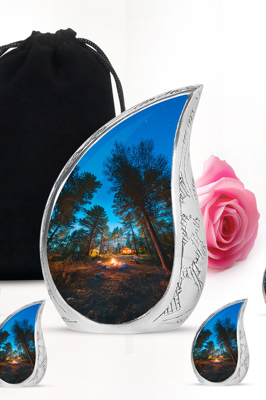 Calming Blue Campfire Cremation Urn side profile showing urn shape - graceful tear-shaped urn with campfire motif - memorial set with one large and four small urns