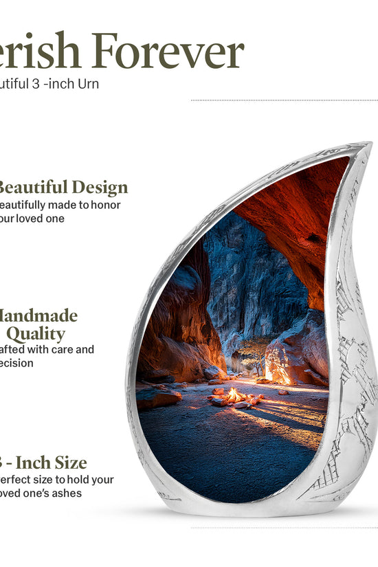 Serene Blue Campfire Cremation Urn angled view of lid and engraved motif - smooth teardrop contour featuring campfire art - mini keepsake memorial for portion of cremation ashes