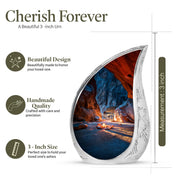 Serene Blue Campfire Cremation Urn angled view of lid and engraved motif - smooth teardrop contour featuring campfire art - mini keepsake memorial for portion of cremation ashes