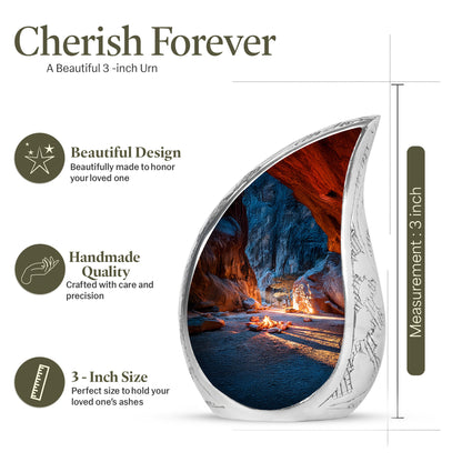 Serene Blue Campfire Cremation Urn angled view of lid and engraved motif - smooth teardrop contour featuring campfire art - mini keepsake memorial for portion of cremation ashes