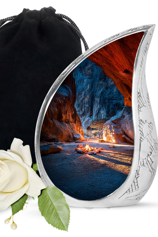 Azure Campfire Cremation Urn front view showing detailed design - flowing teardrop campfire silhouette on curved aluminum - full-size 10 inch 200 cubic inch adult cremation urn