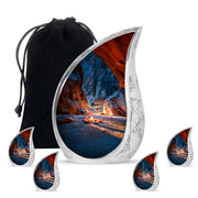 Dusty Blue Campfire Cremation Urn side profile showing urn shape - rounded teardrop campfire design with delicate detail - memorial set with one large and four small urns