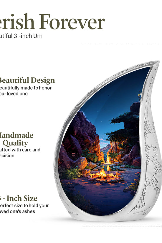 Calming Blue Campfire Cremation Urn angled view of lid and engraved motif - smooth teardrop contour featuring campfire art - mini keepsake memorial for portion of cremation ashes