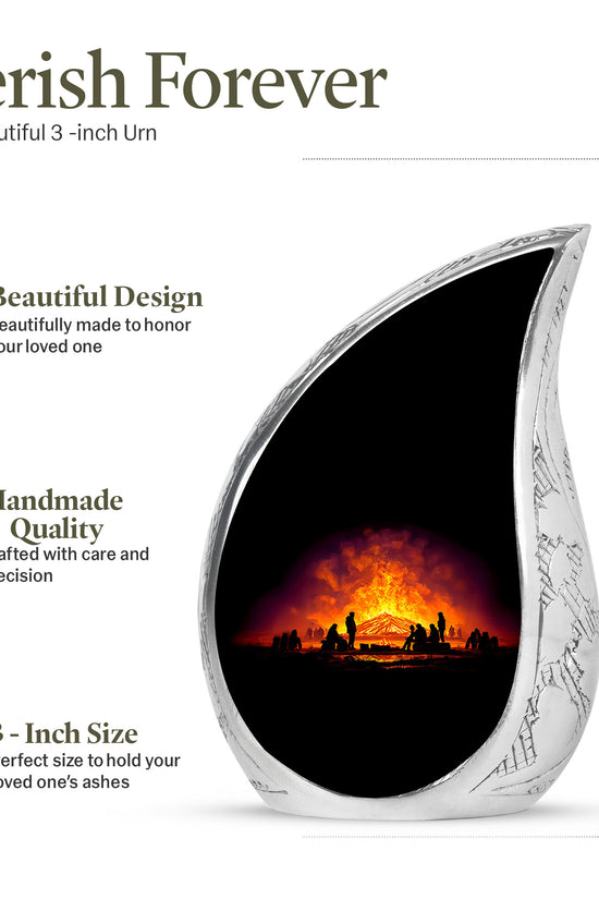 Deep Black Campfire Cremation Urn angled view of lid and engraved motif - flowing teardrop campfire silhouette on curved aluminum - mini keepsake memorial for portion of cremation ashes