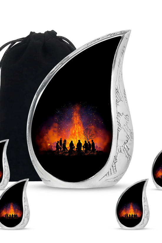 Ebony Campfire Cremation Urn side profile showing urn shape - flowing teardrop campfire silhouette on curved aluminum - memorial set with one large and four small urns