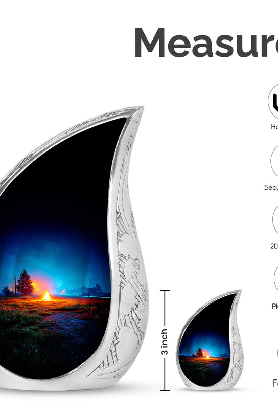 Bright Blue Campfire Cremation Urn angled view of lid and engraved motif - graceful tear-shaped urn with campfire motif - mini keepsake memorial for portion of cremation ashes