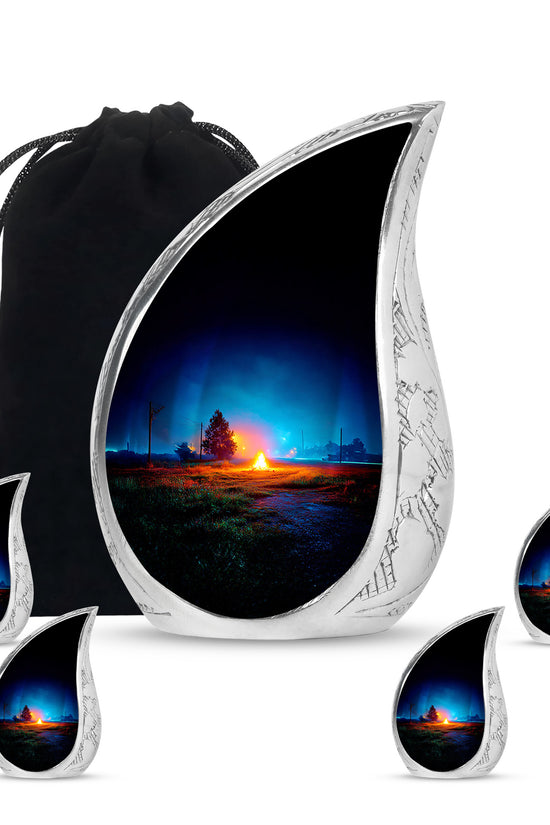 Twilight Blue Campfire Cremation Urn side profile showing urn shape - smooth teardrop contour featuring campfire art - memorial set with one large and four small urns