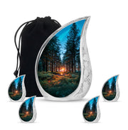 Icy Blue Campfire Cremation Urn side profile showing urn shape - flowing teardrop campfire silhouette on curved aluminum - memorial set with one large and four small urns