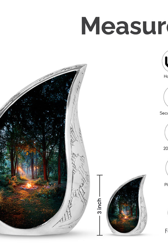 Rich Black Campfire Cremation Urn angled view of lid and engraved motif - flowing teardrop campfire silhouette on curved aluminum - mini keepsake memorial for portion of cremation ashes