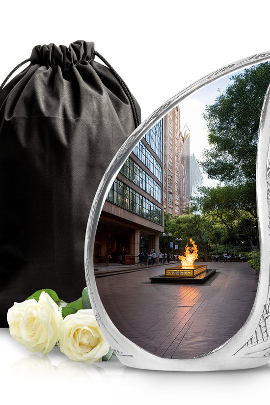 Rich Black Campfire Cremation Urn front view showing detailed design - flowing teardrop campfire silhouette on curved aluminum - full-size 10 inch 200 cubic inch adult cremation urn