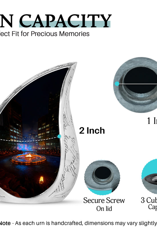 Midnight Black Campfire Cremation Urn angled view of lid and engraved motif - graceful tear-shaped urn with campfire motif - mini keepsake memorial for portion of cremation ashes