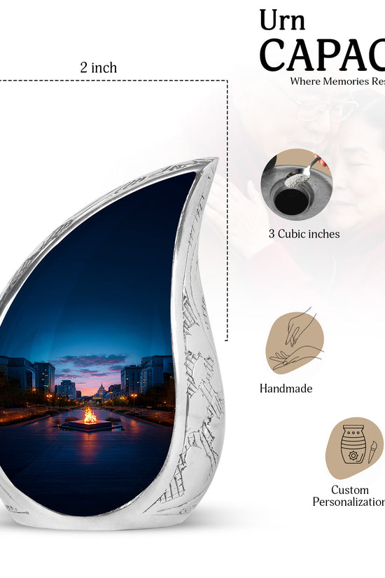 Serene Blue Campfire Cremation Urn angled view of lid and engraved motif - smooth teardrop contour featuring campfire art - mini keepsake memorial for portion of cremation ashes