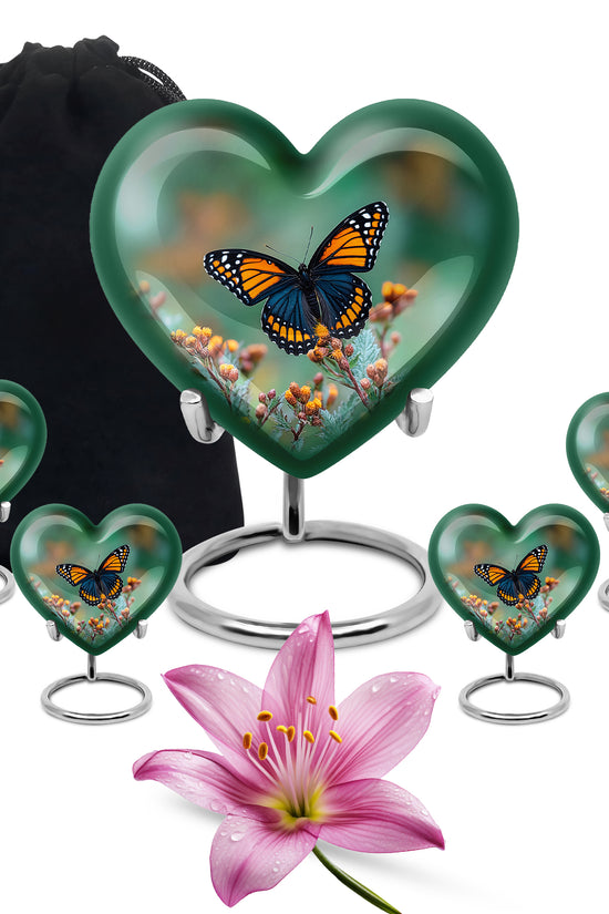 Mint Green Butterfly Cremation Urn close-up of engraving and surface detail - romantic heart urn with butterfly motif on aluminum - memorial set with one large and four small urns