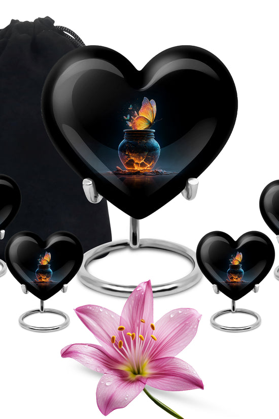 Charcoal Black Butterfly Cremation Urn close-up of engraving and surface detail - compassionate heart-butterfly combination with gentle curves - memorial set with one large and four small urns