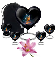 Glossy Black Butterfly Cremation Urn close-up of engraving and surface detail - heart-shaped butterfly design symbolizing eternal love - memorial set with one large and four small urns