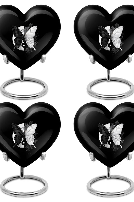 Rich Black Butterfly Cremation Urn angled view of lid and engraved motif - heart-shaped butterfly design symbolizing eternal love - 10 inch aluminum urn for cremated remains