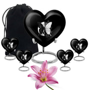 Obsidian Black Butterfly Cremation Urn close-up of engraving and surface detail - compassionate heart-butterfly combination with gentle curves - memorial set with one large and four small urns