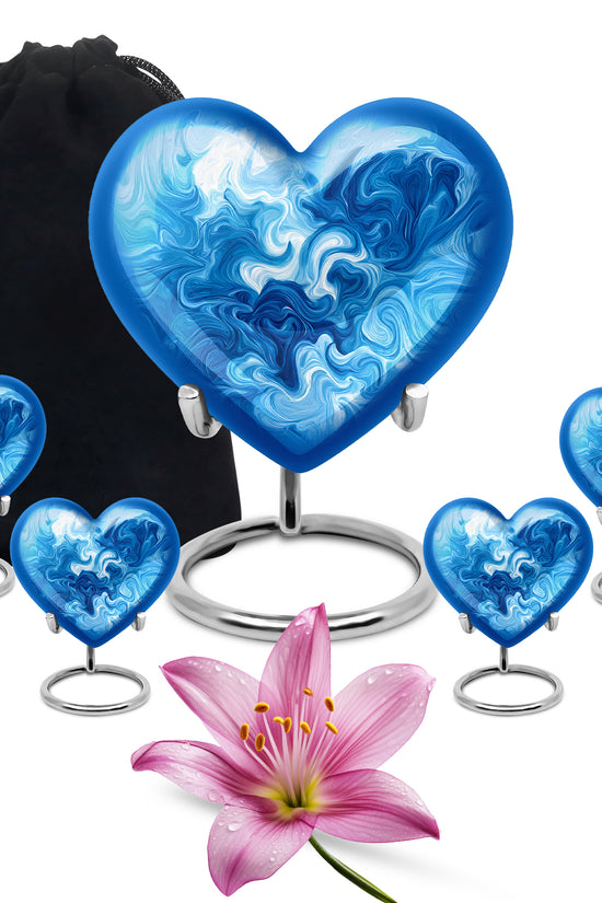 Dusty Blue Blue Cremation Urn close-up of engraving and surface detail - heart-shaped blue design symbolizing eternal love - memorial set with one large and four small urns