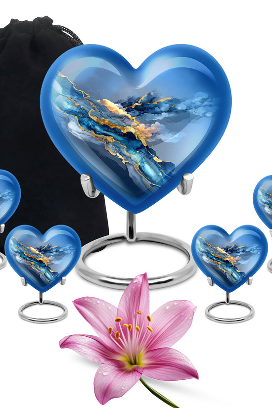 Icy Blue Blue Cremation Urn close-up of engraving and surface detail - heart-shaped blue design symbolizing eternal love - memorial set with one large and four small urns