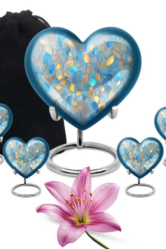Bright Blue Blue Cremation Urn close-up of engraving and surface detail - romantic heart urn with blue motif on aluminum - memorial set with one large and four small urns