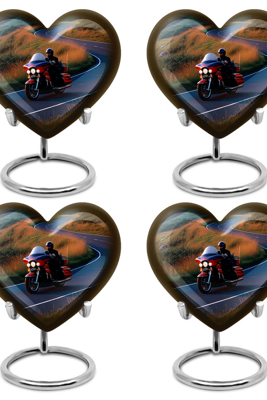 Sapphire Blue Bike Cremation Urn angled view of lid and engraved motif - compassionate heart-bike combination with gentle curves - 10 inch aluminum urn for cremated remains