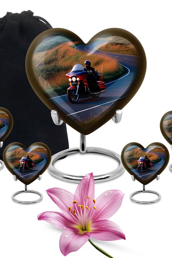 Sapphire Blue Bike Cremation Urn close-up of engraving and surface detail - compassionate heart-bike combination with gentle curves - memorial set with one large and four small urns