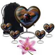Sapphire Blue Bike Cremation Urn close-up of engraving and surface detail - compassionate heart-bike combination with gentle curves - memorial set with one large and four small urns
