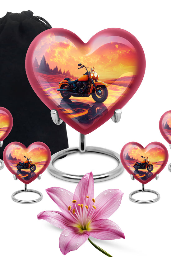 Vintage Pink Bike Cremation Urn close-up of engraving and surface detail - romantic heart urn with bike motif on aluminum - memorial set with one large and four small urns