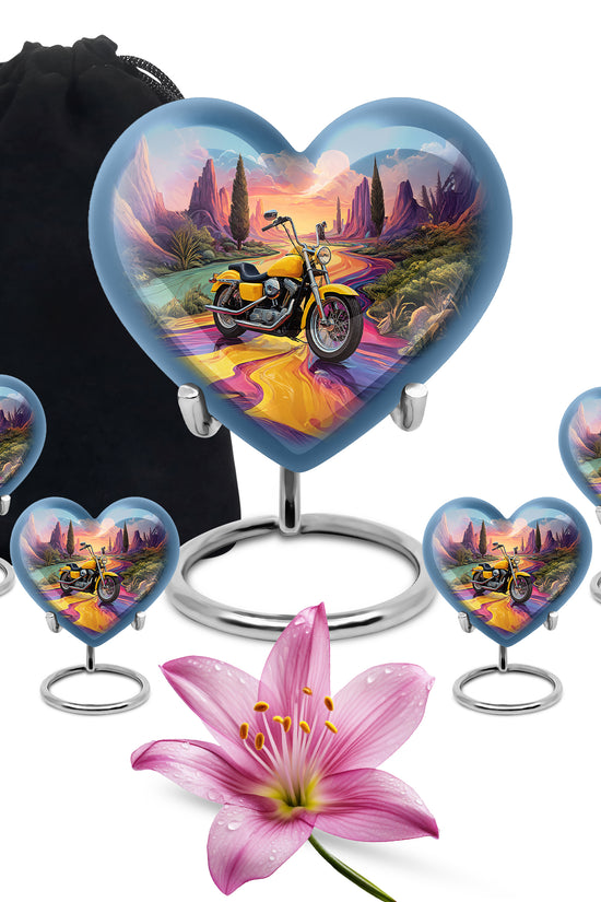 Indigo Bike Cremation Urn close-up of engraving and surface detail - heart-shaped bike design symbolizing eternal love - memorial set with one large and four small urns