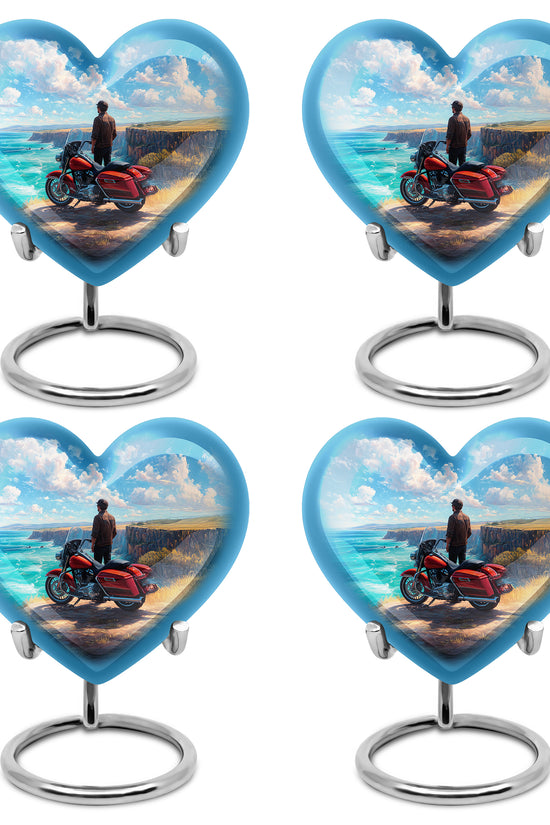 Soft Blue Bike Cremation Urn angled view of lid and engraved motif - romantic heart urn with bike motif on aluminum - 10 inch aluminum urn for cremated remains