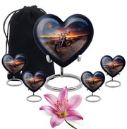 Deep Black Bike Cremation Urn close-up of engraving and surface detail - loving heart memorial featuring bike pattern - memorial set with one large and four small urns