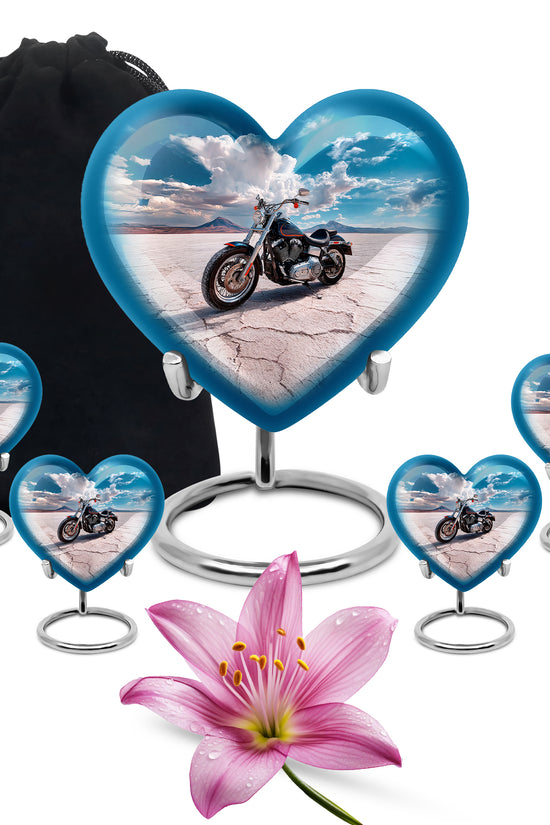Sapphire Blue Bike Cremation Urn close-up of engraving and surface detail - compassionate heart-bike combination with gentle curves - memorial set with one large and four small urns