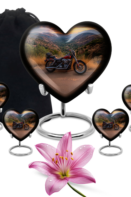 Serene Blue Bike Cremation Urn close-up of engraving and surface detail - compassionate heart-bike combination with gentle curves - memorial set with one large and four small urns
