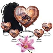 Deep Red Bike Cremation Urn close-up of engraving and surface detail - loving heart memorial featuring bike pattern - memorial set with one large and four small urns