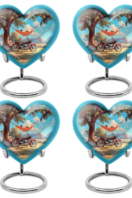 Sea Green Teal Bike Cremation Urn angled view of lid and engraved motif - heart-shaped bike design symbolizing eternal love - 10 inch aluminum urn for cremated remains