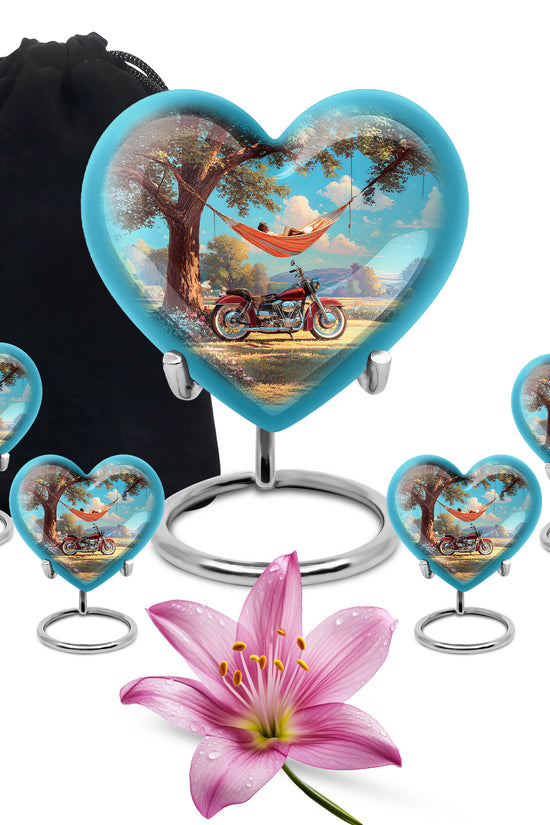 Tropical Teal Bike Cremation Urn close-up of engraving and surface detail - compassionate heart-bike combination with gentle curves - memorial set with one large and four small urns