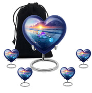 Calming Blue Beach Cremation Urn close-up of engraving and surface detail - romantic heart urn with beach motif on aluminum - memorial set with one large and four small urns