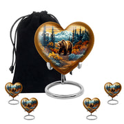 Gilded Gold Bear Cremation Urn close-up of engraving and surface detail - heart-shaped bear design symbolizing eternal love - memorial set with one large and four small urns