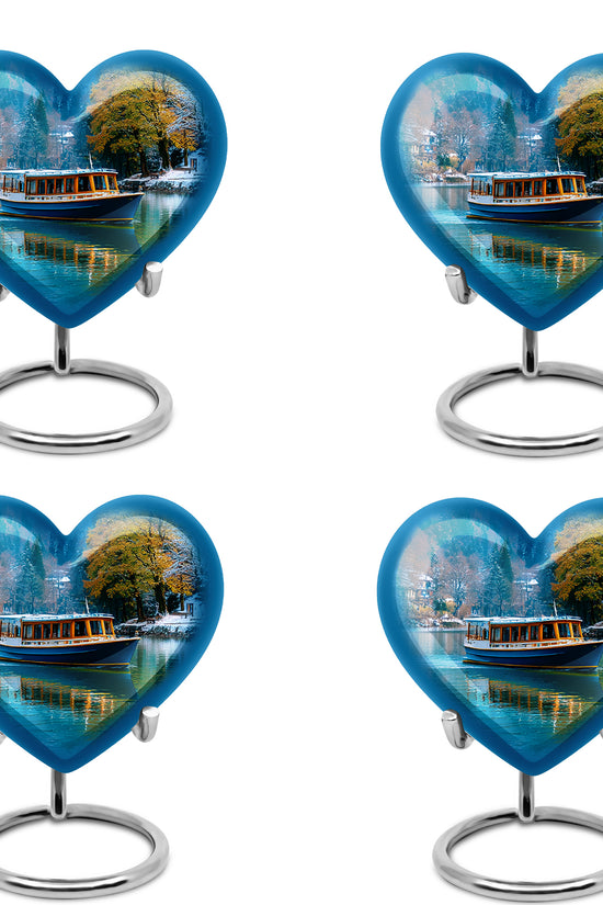 Misty Blue Boat Cremation Urn angled view of lid and engraved motif - heart-shaped boat design symbolizing eternal love - 10 inch aluminum urn for cremated remains