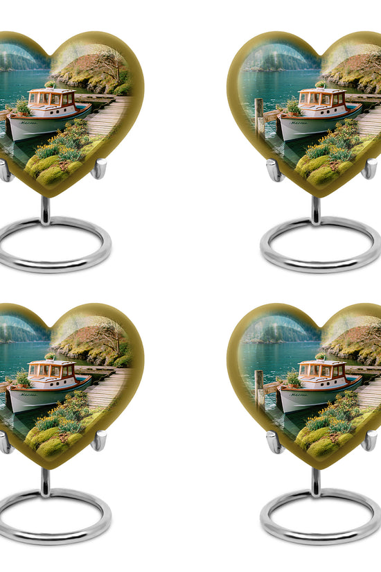Soft Teal Boat Cremation Urn angled view of lid and engraved motif - heart-shaped boat design symbolizing eternal love - 10 inch aluminum urn for cremated remains