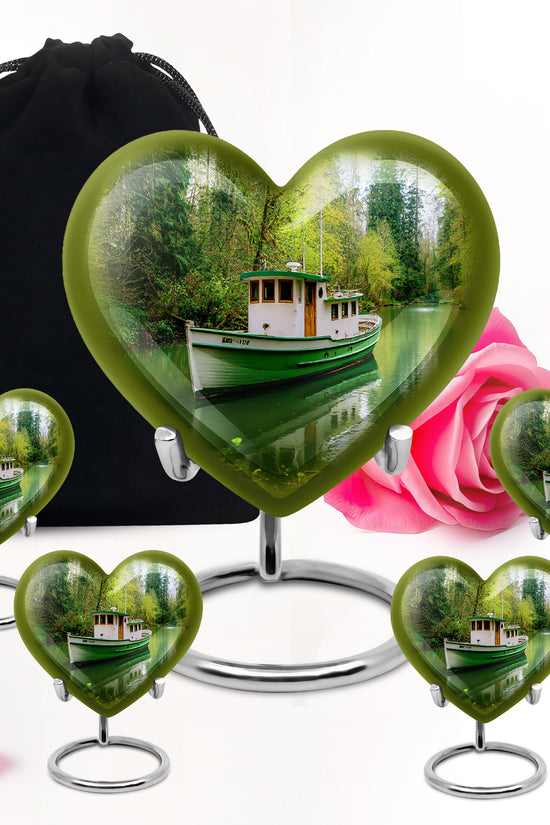 Pine Green Boat Cremation Urn close-up of engraving and surface detail - romantic heart urn with boat motif on aluminum - memorial set with one large and four small urns