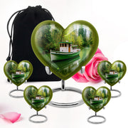 Pine Green Boat Cremation Urn close-up of engraving and surface detail - romantic heart urn with boat motif on aluminum - memorial set with one large and four small urns