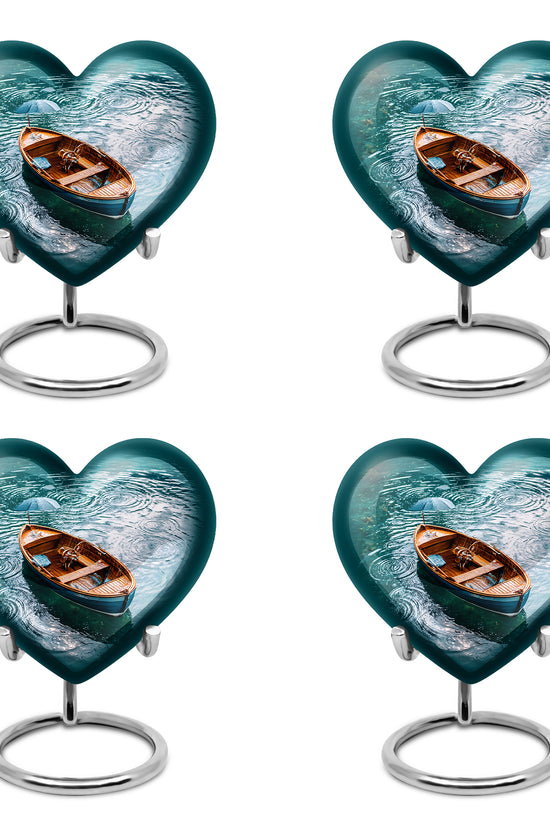 Ocean Teal Boat Cremation Urn angled view of lid and engraved motif - heart-shaped boat design symbolizing eternal love - 10 inch aluminum urn for cremated remains