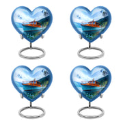 Icy Blue Boat Cremation Urn angled view of lid and engraved motif - heart-shaped boat design symbolizing eternal love - 10 inch aluminum urn for cremated remains