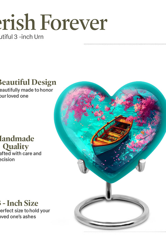 Deep Teal Boat Cremation Urn front view showing detailed design - romantic heart urn with boat motif on aluminum - mini keepsake memorial for portion of cremation ashes